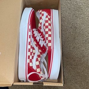 Red and white checkered old skool vans